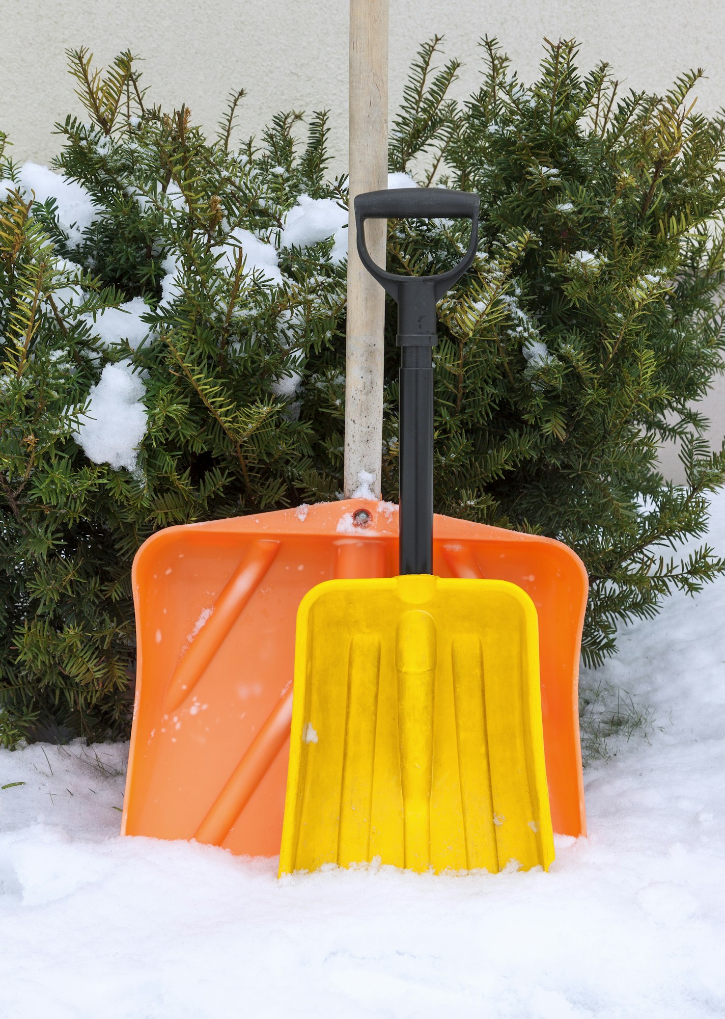 Two snow shovels in winter